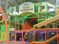 Play area with multiple slides in Hide N Seek Indoor Playground near Acclaim Hotel Calgary