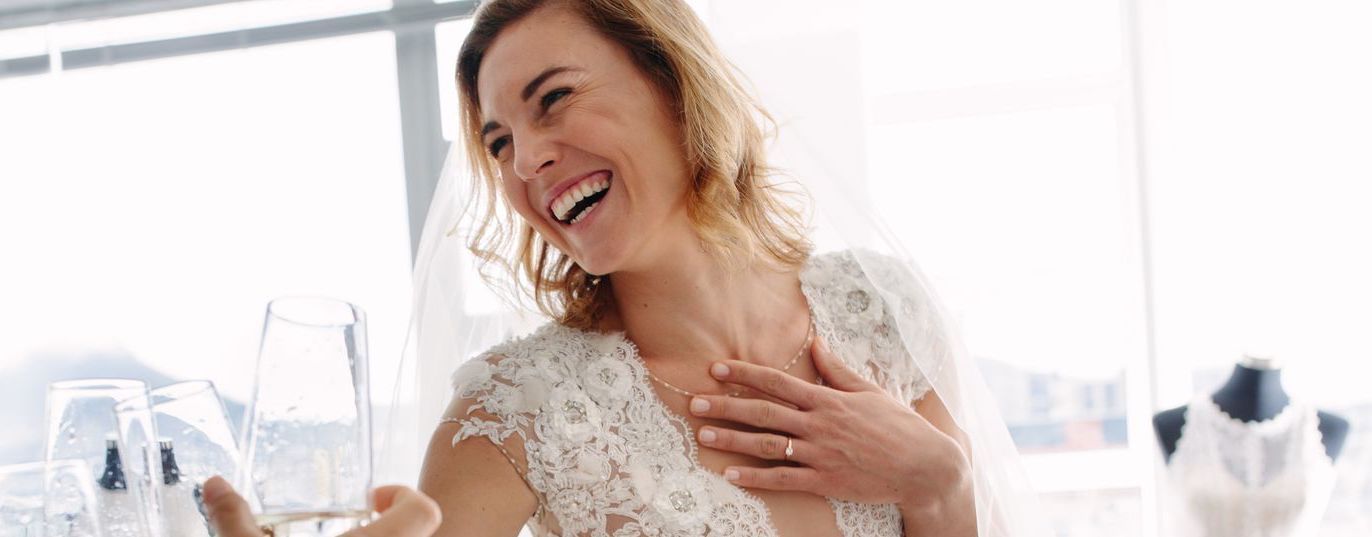 Bride laughing in wedding dress