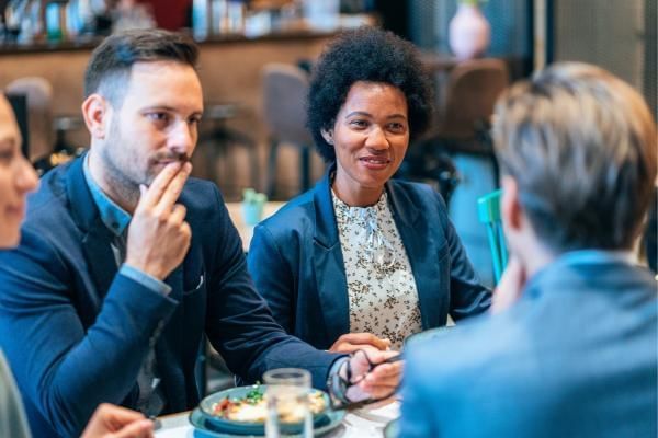 People enjoying a business lunch together