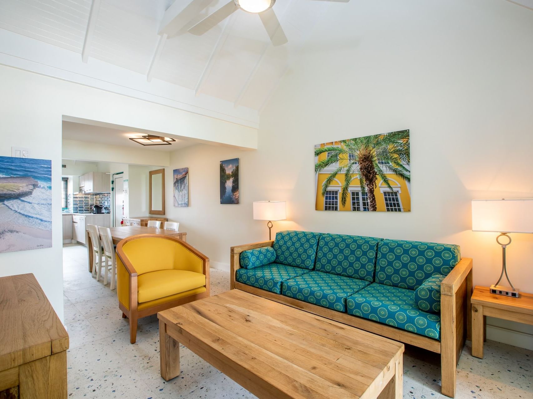 Dining table by lounge area in Two Bedroom Suite at Passions on the Beach