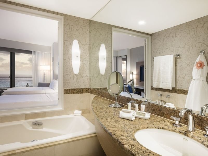 Bathroom with vanity & tub in 2 Double Beds Oceanfront View at The Diplomat Resort