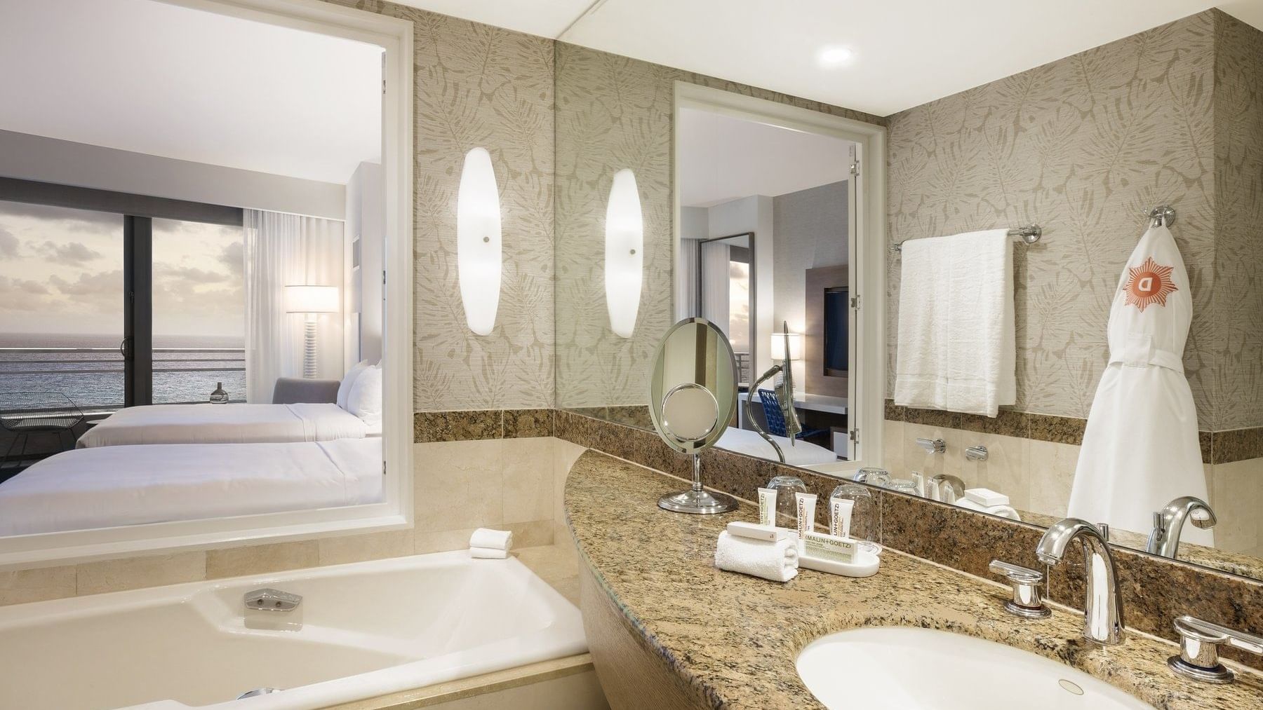 Bathroom vanity with bathtub in Oceanfront Guestroom at Diplomat Beach Resort