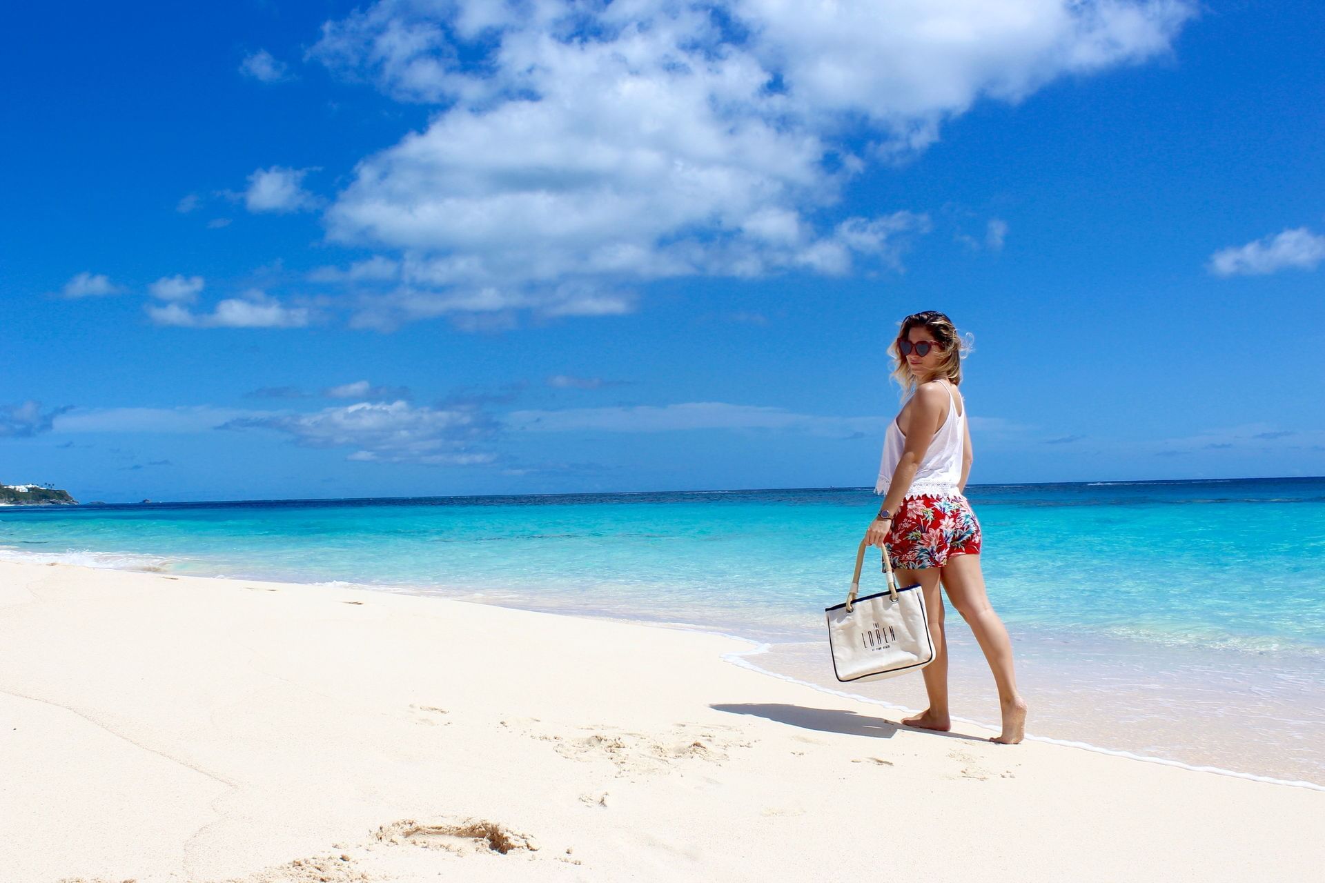 The Loren - Girl walking on the beach