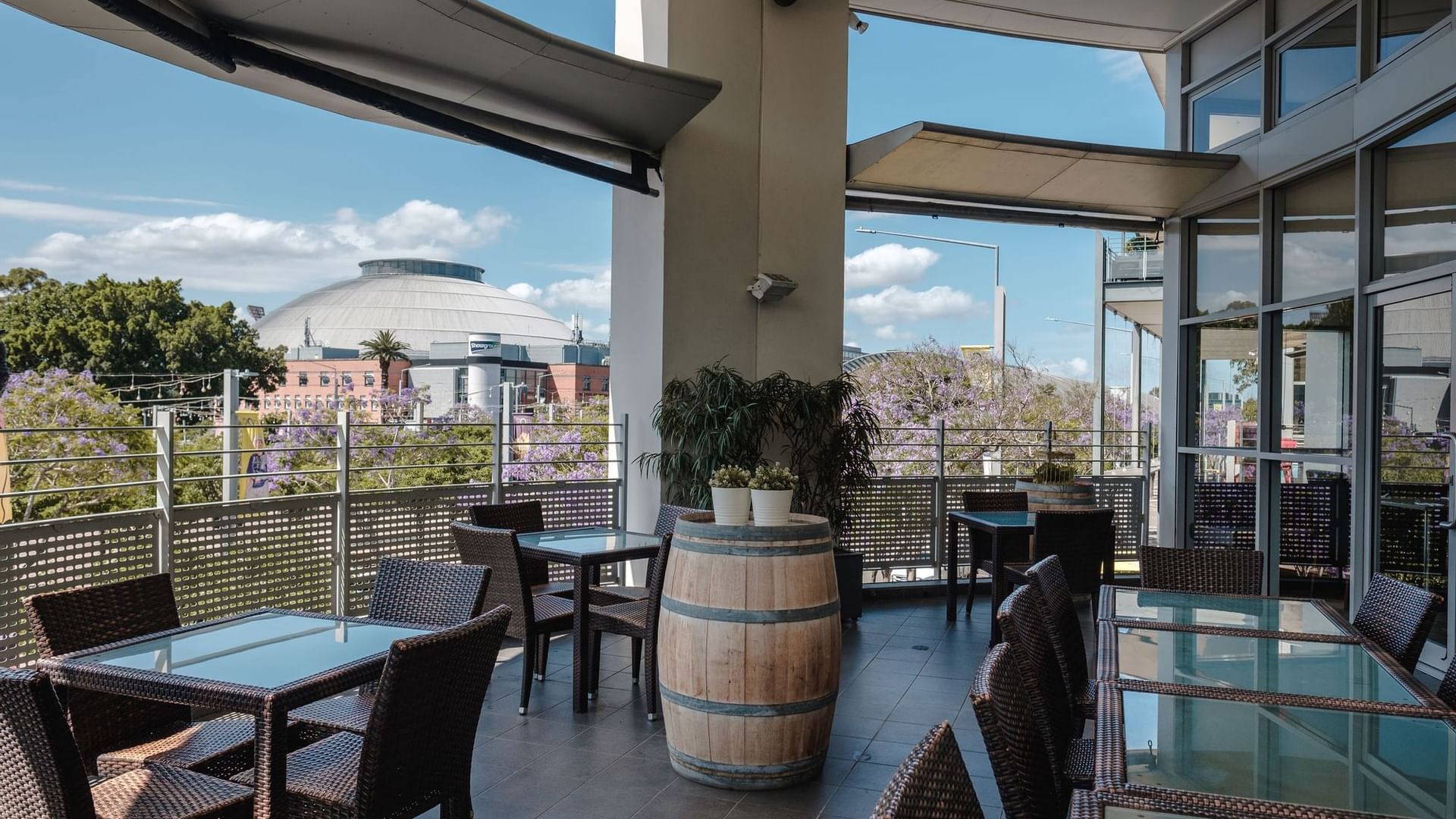 Balcony dining & lounge area at Novotel Sydney Olympic Park