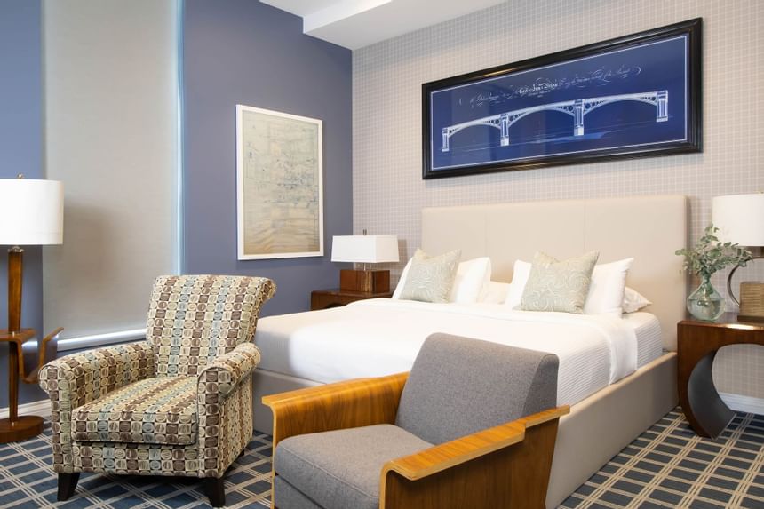 King bed & comfy chairs in King Superior Study at Retro Suites Hotel