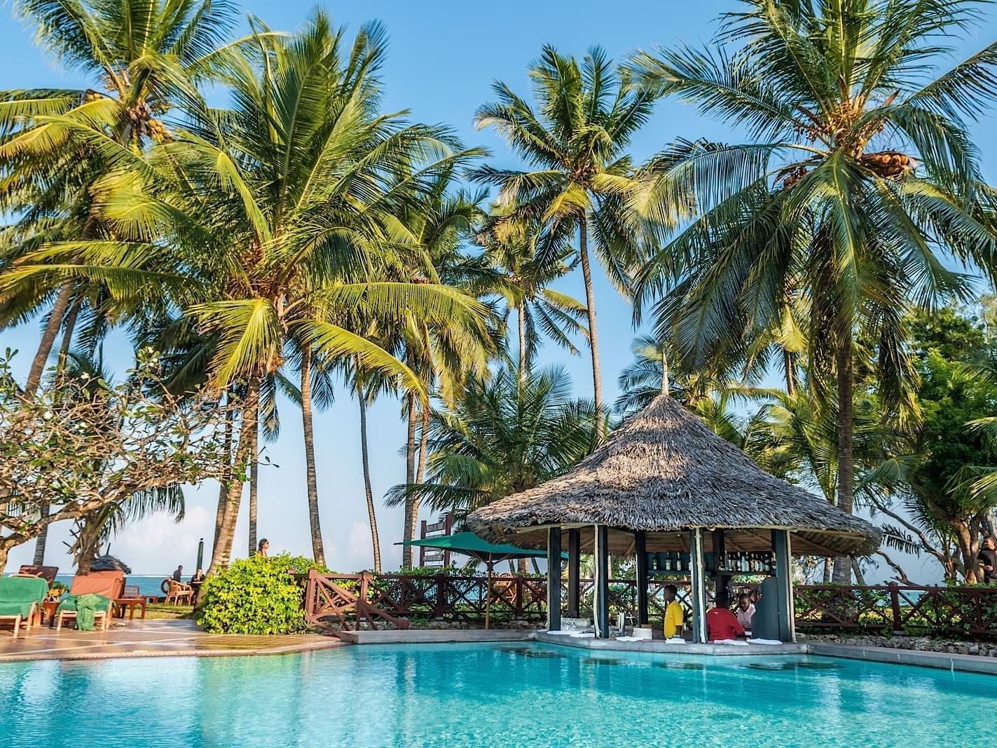 Guests enjoying the swim-up pool bar at Serena Beach Resort & Spa in Mombasa.