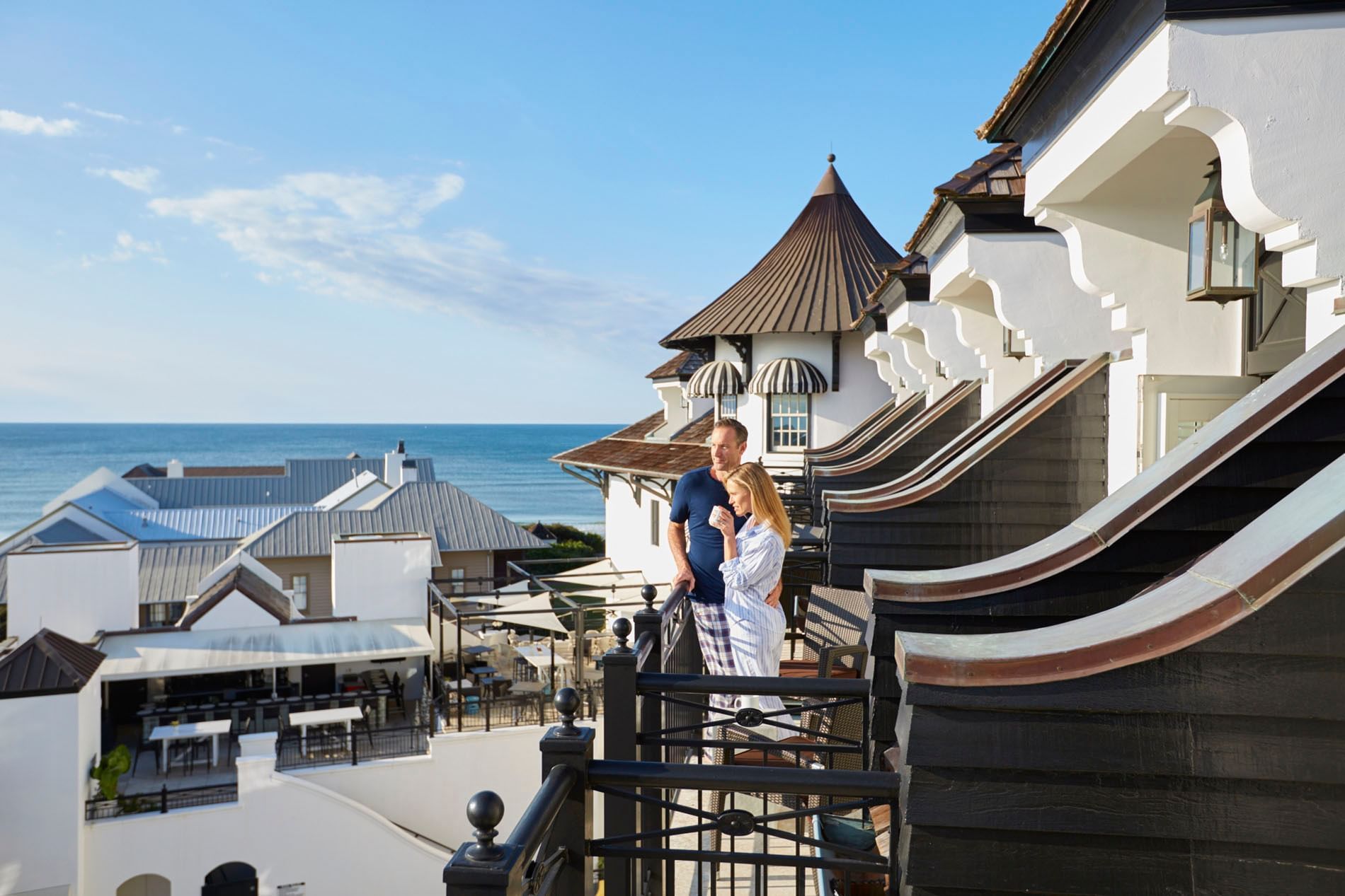 Couple standing on the balcony of Pearl Room at The Pearl Hotel