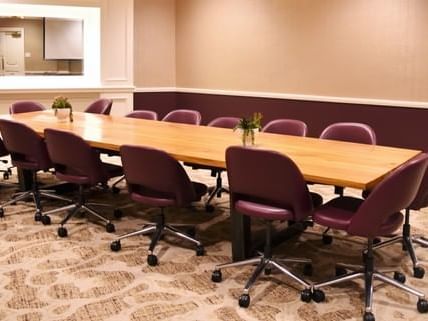 A conference table arranged in Raquet Room at The Fredonia Hotel