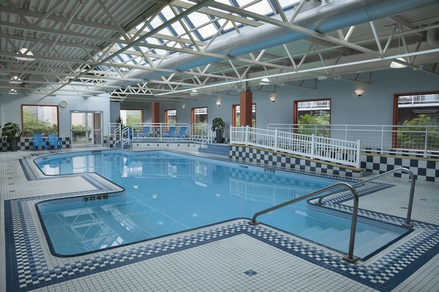 Indoor pool with loungers at Hotel Halifax