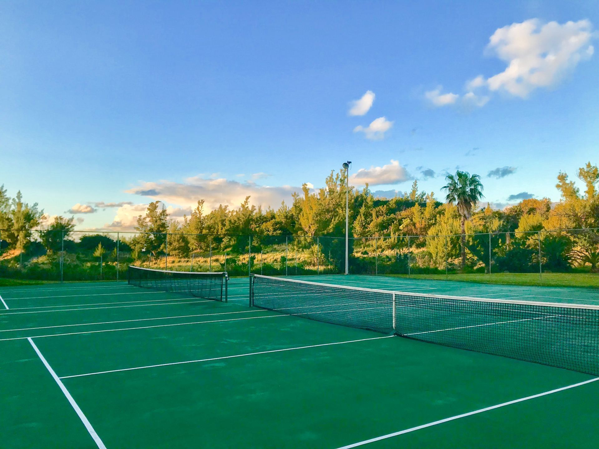 Outdoor spacious Tennis court at St George's Club Bermuda Hotel