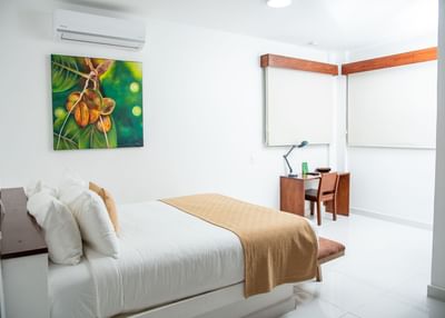 Interior of Two-Bedroom Suite with a working desk at Cha Cha Hotel
