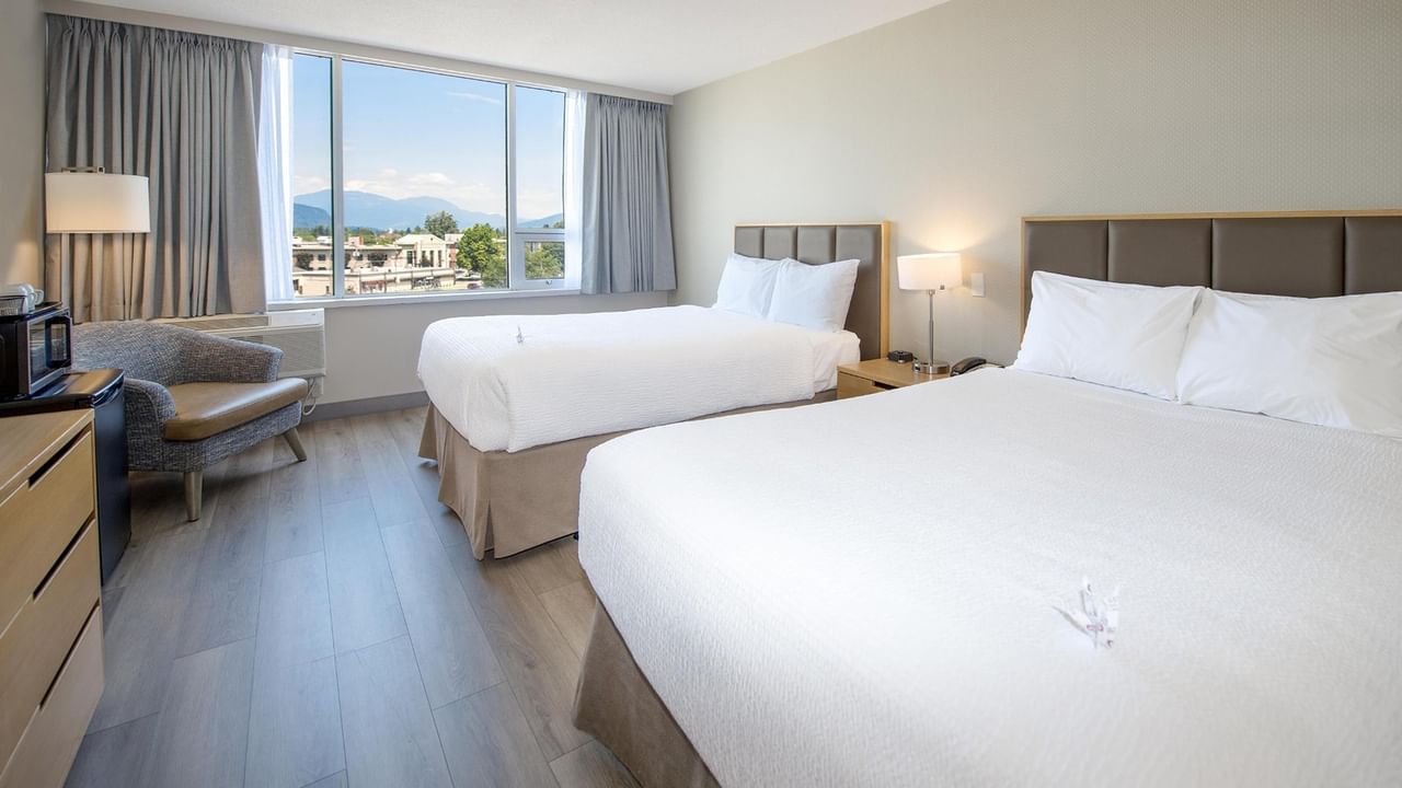 Hotel room with two queen beds.
