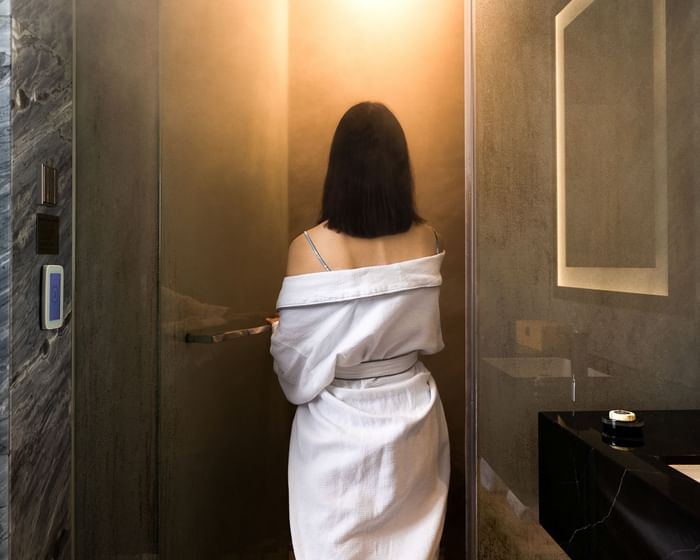 Indulge in refined wellness in Grand Park City Hall’s suites, featuring a private steam shower.
