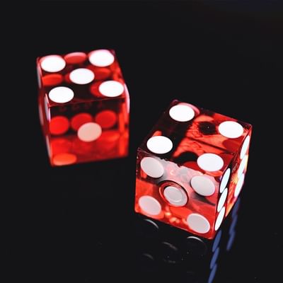 2 red dice on black background Casino near Falkensteiner Hotels