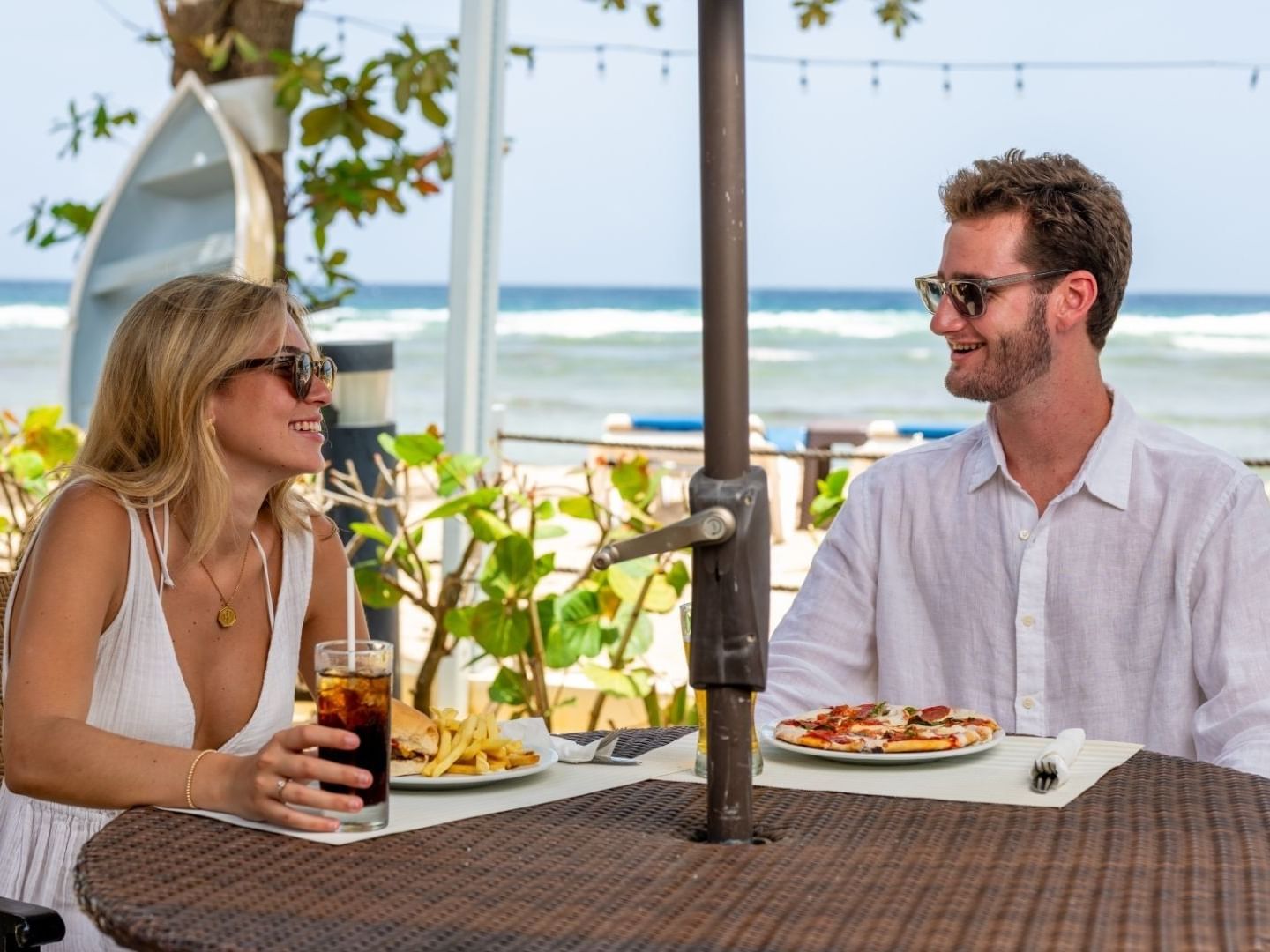 Couple dining with ocean view at Savannah Beach Hotel.