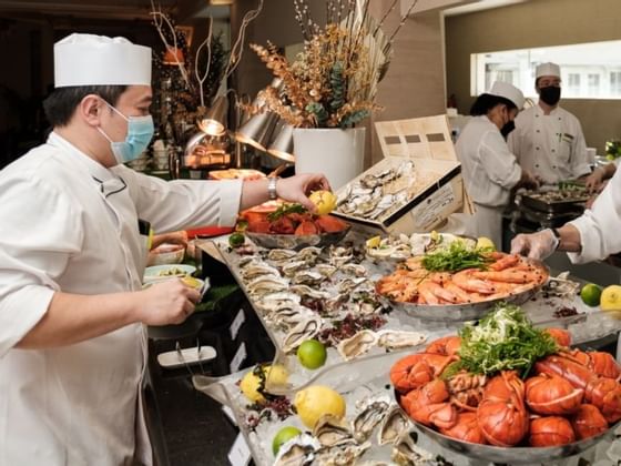 Chef arranging the buffet in restaurant at Goodwood Park Hotel