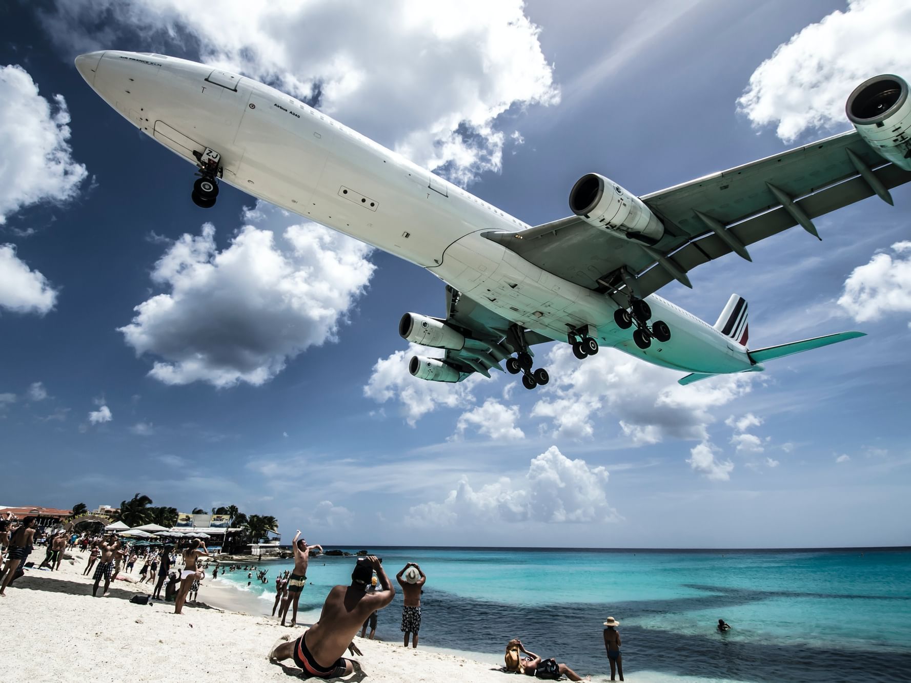 Jet flying over Mavo Beach near Morgan Resort Spa Village