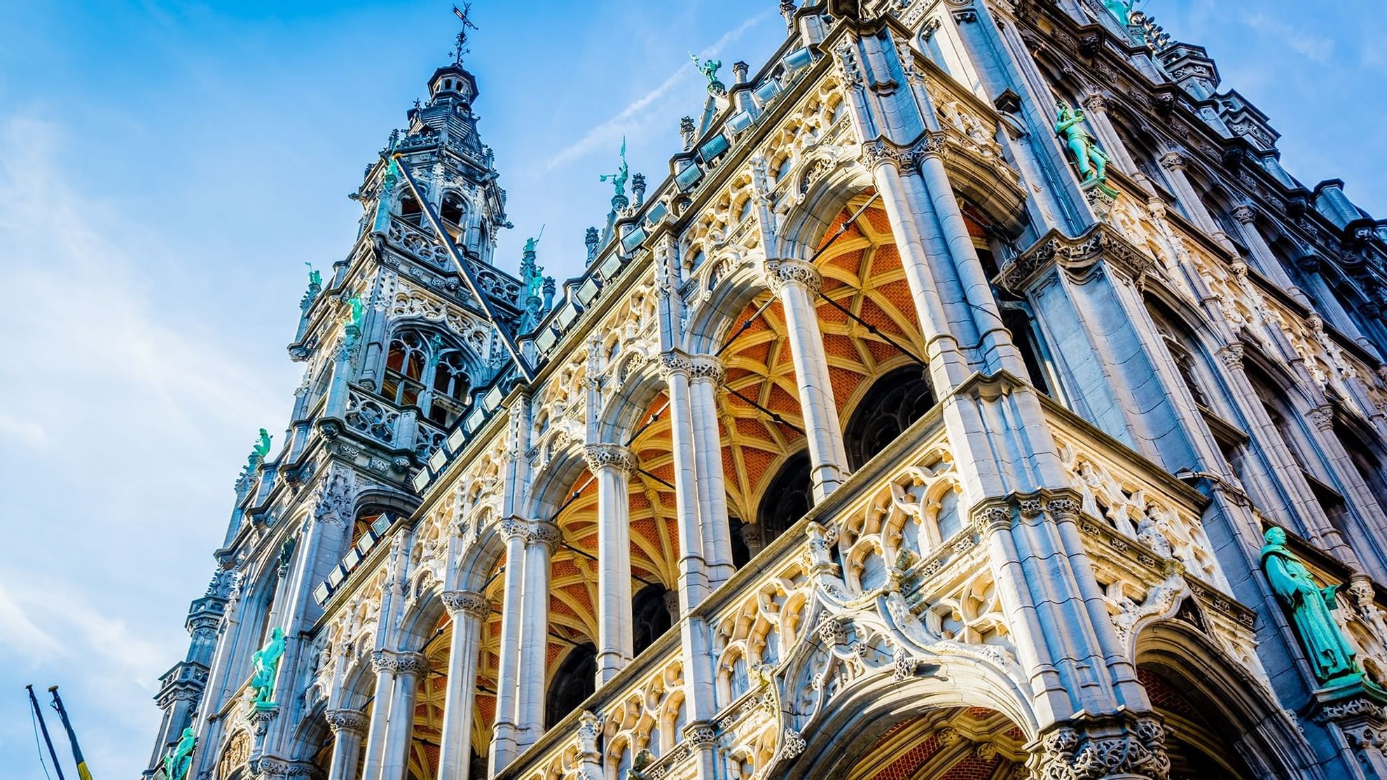 A close-up view of the grand place building near Warwick Hotels and Resorts with intricate stone carvings