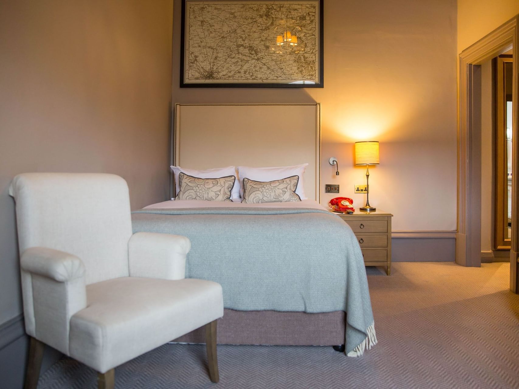 Lounge & double bed with a cushioned headboard in Urban Double, accommodation in York at The Milner York