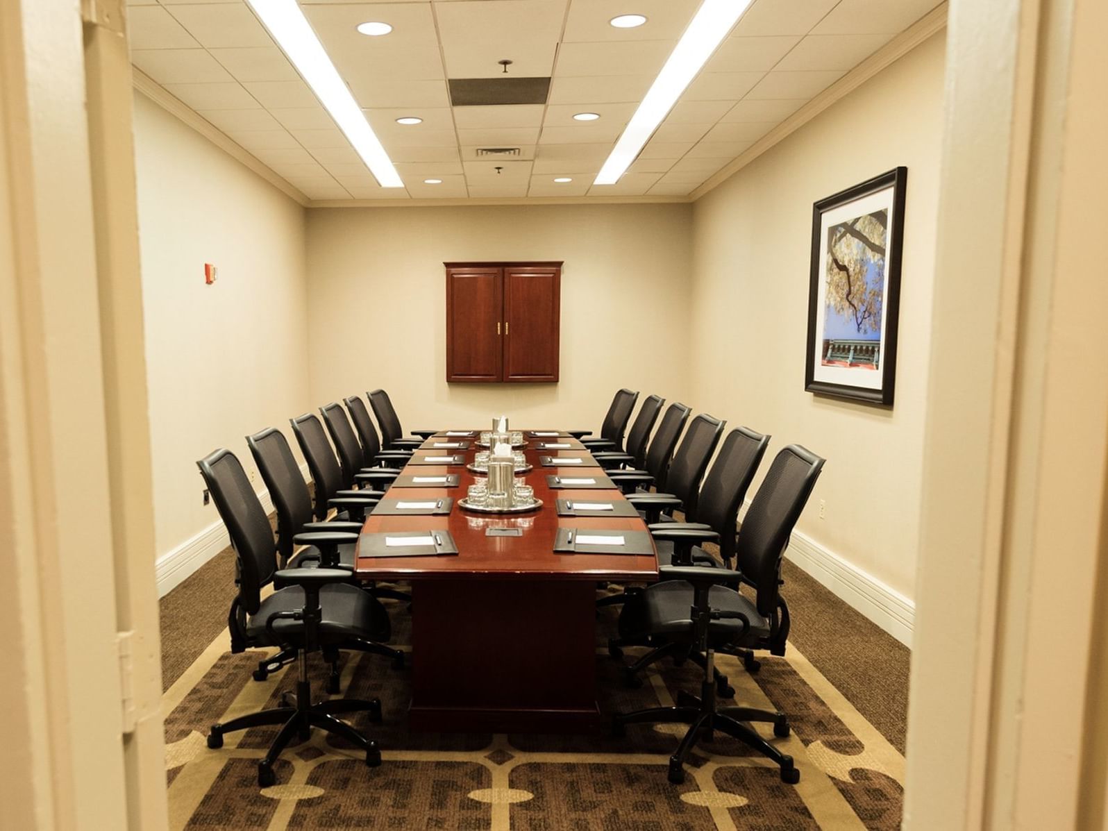 meeting room with conference table and black chairs