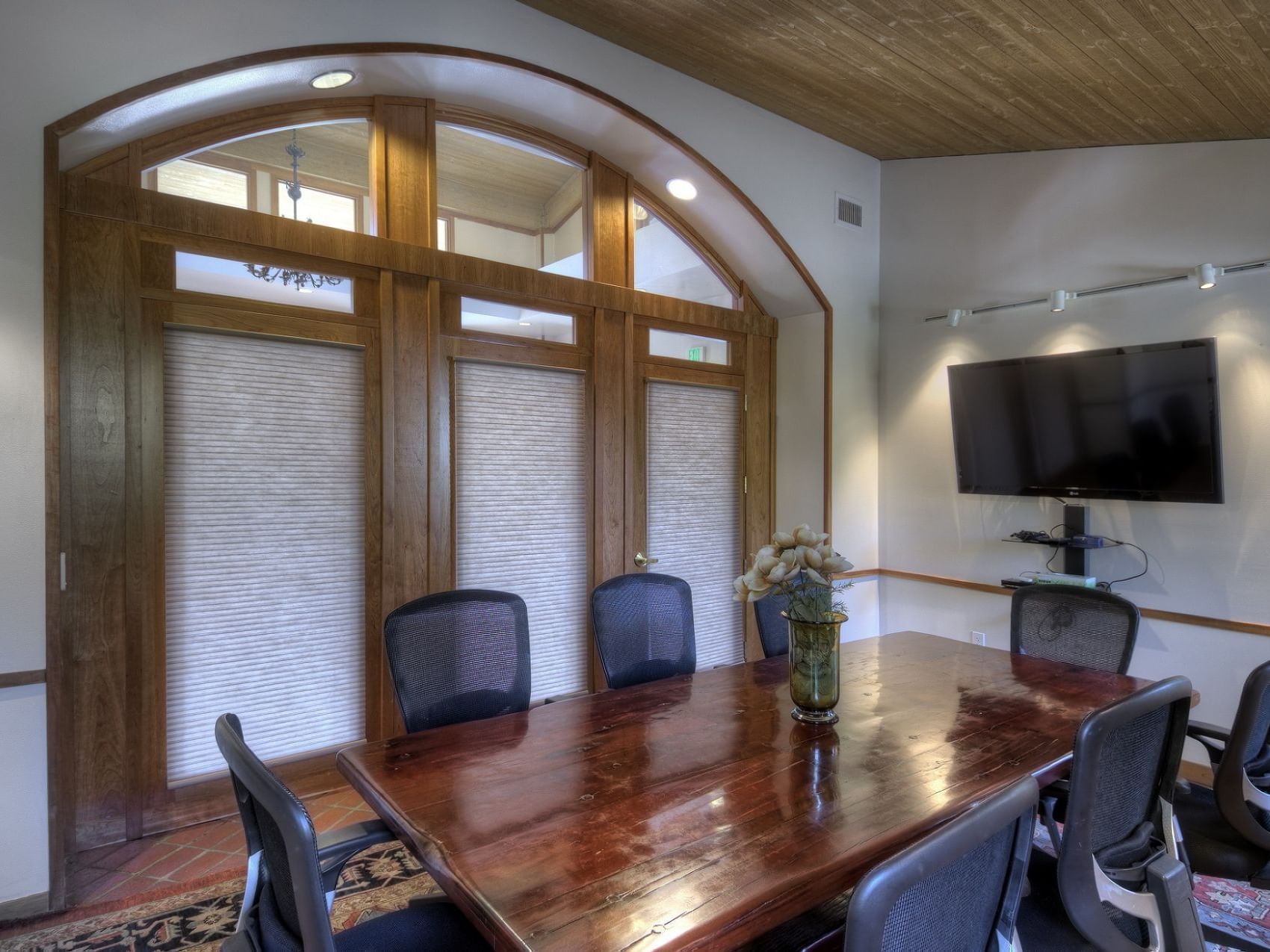 Table & TV in Dinah's Boardroom at Dinah's Garden Hotel