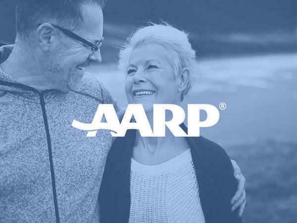 An elder couple in AARP Member Discount Banner at Aqua Hotel
