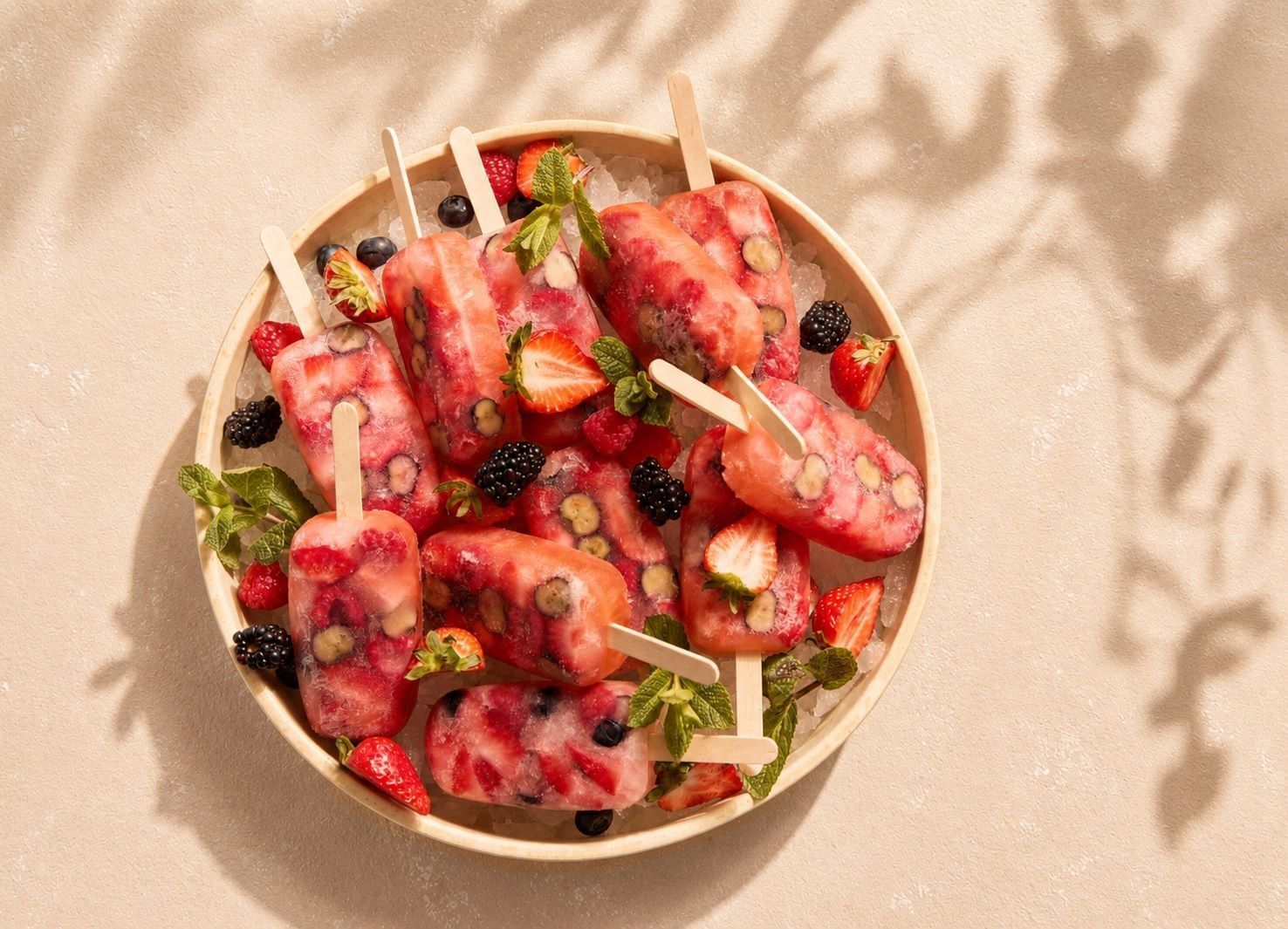 Round platter of fresh berry ice pops at the Summer Terrace dining area at The Londoner Hotel