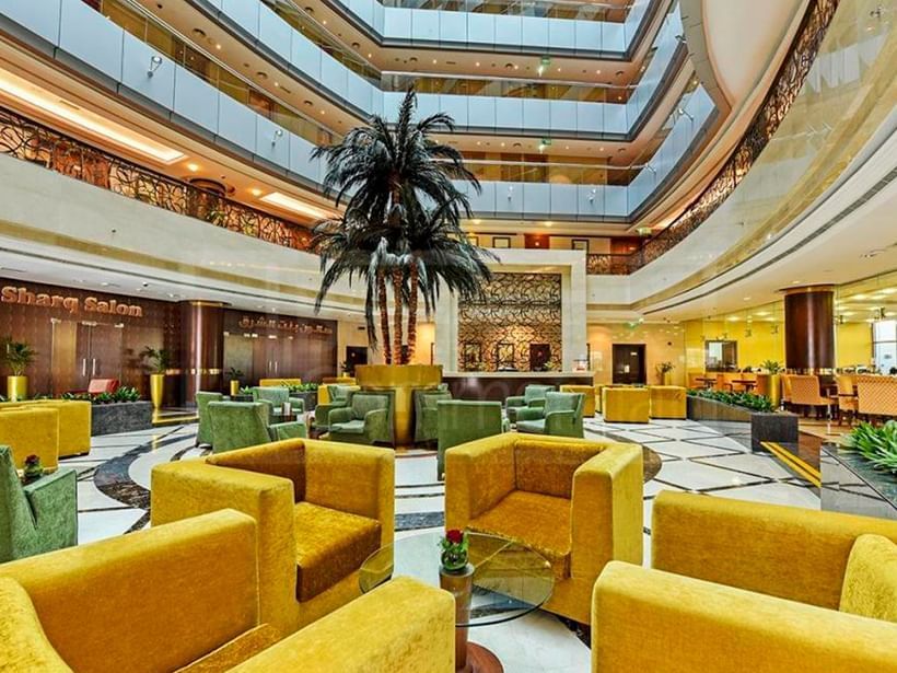 Cozy chairs in Al Nakheel lobby lounge at City Seasons Hotels