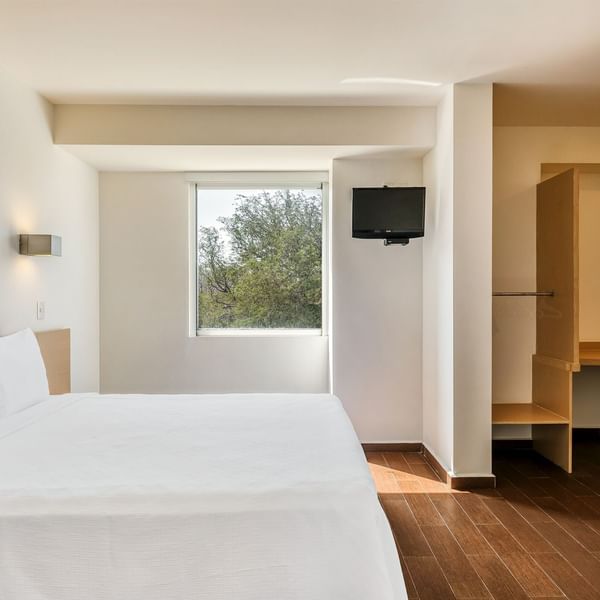 King bed with a TV in Accessible Room at One Hotels