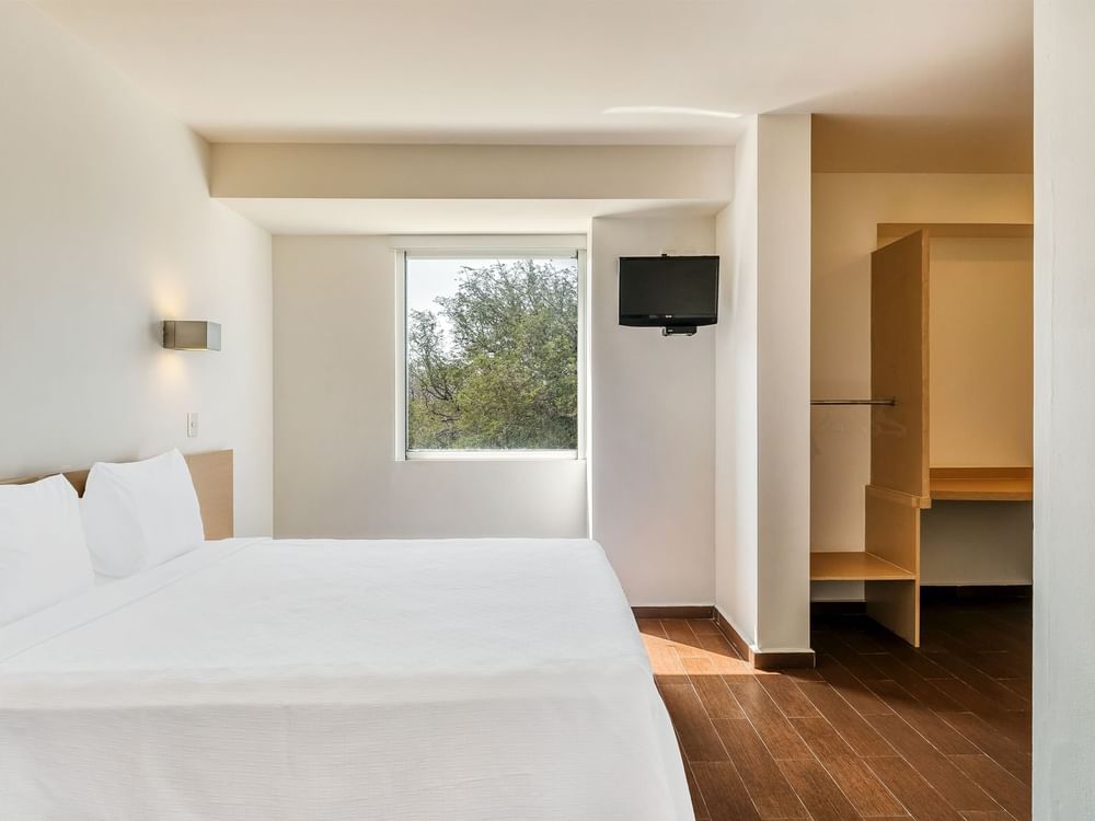 King bed with a TV in Accessible Room at One Hotels