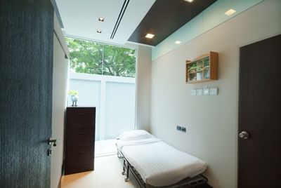 First Aid Room with bed & cupboard at Amora Hotel