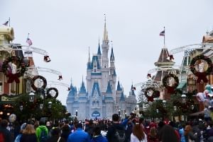 Cinderella's Castle in the background of Magic Kingdom during Christmas time. 