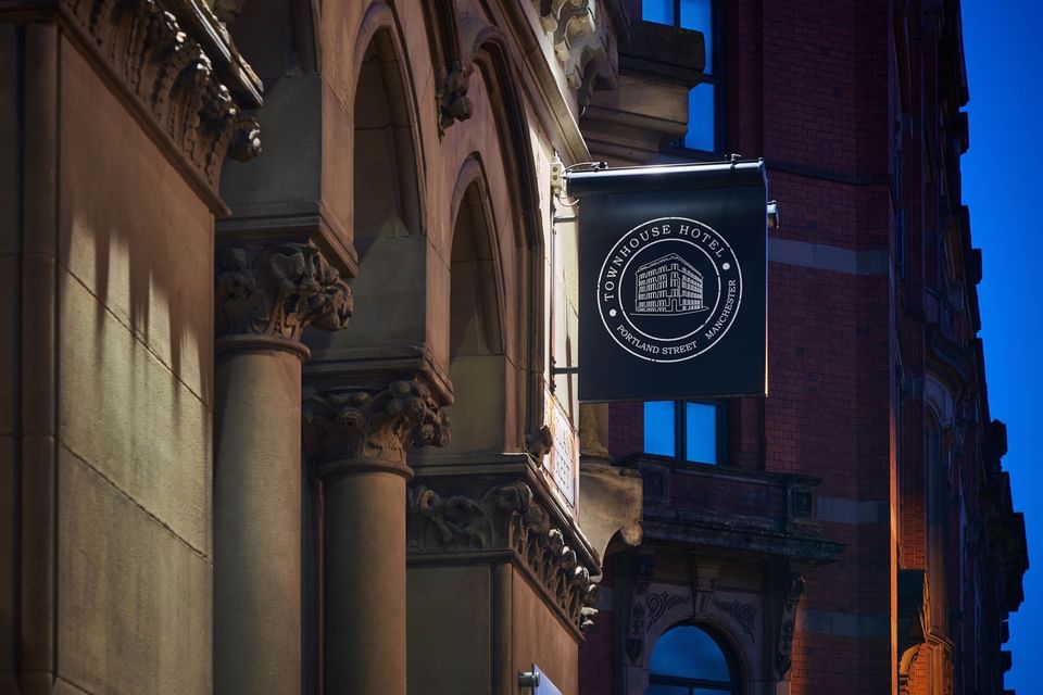 Exterior view of hotel with logo banner at Townhouse Manchester