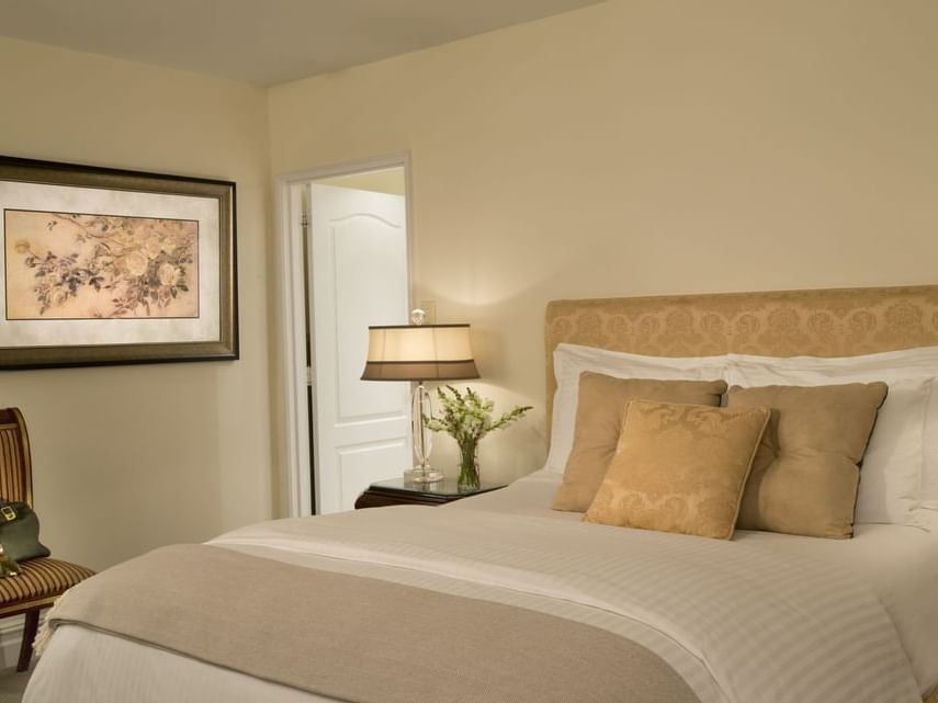 Bed beneath framed art in Accessible Studio ADA at The Kimberly Hotel, showcasing a comfortable hotel suite in New York City