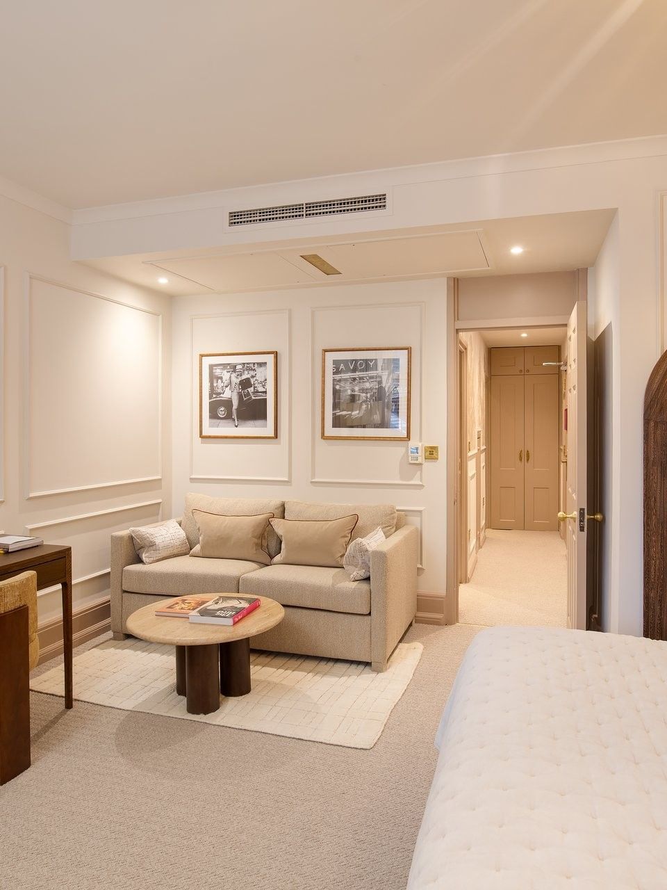 TV lounge with working desk and bed in Studio Apartment at The Capital Hotel, Apartments & Townhouse