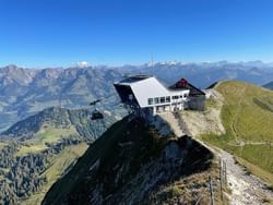 Moleson cable car station on a mountain peak with stunning alpine views near Hotel des Innovations