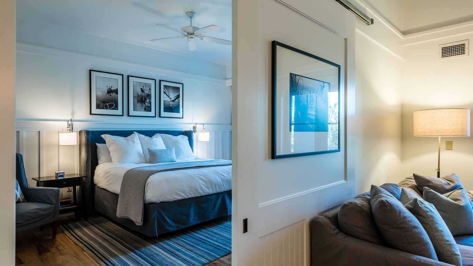 Resort Suite with living area and comfy king bed at Watersound Inn