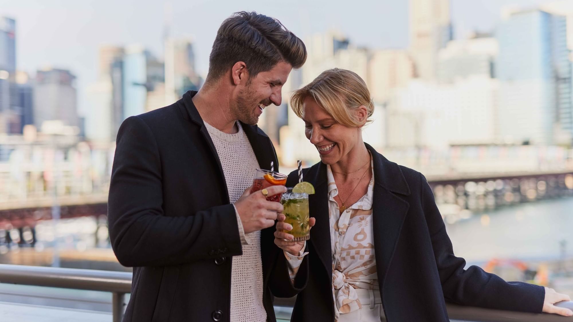 Couple enjoying sunset drinks on ibis bar deck