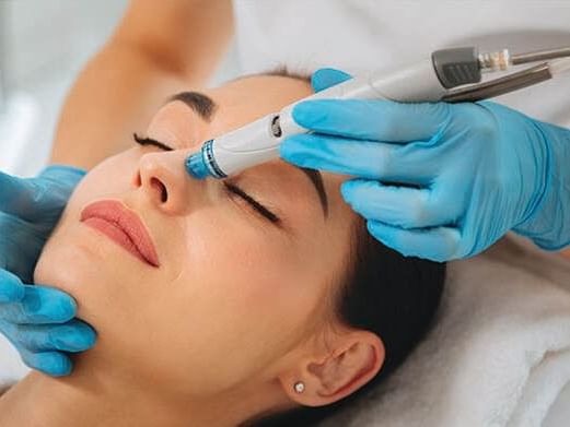 A girl doing a facial treatment at Ajman Hotel