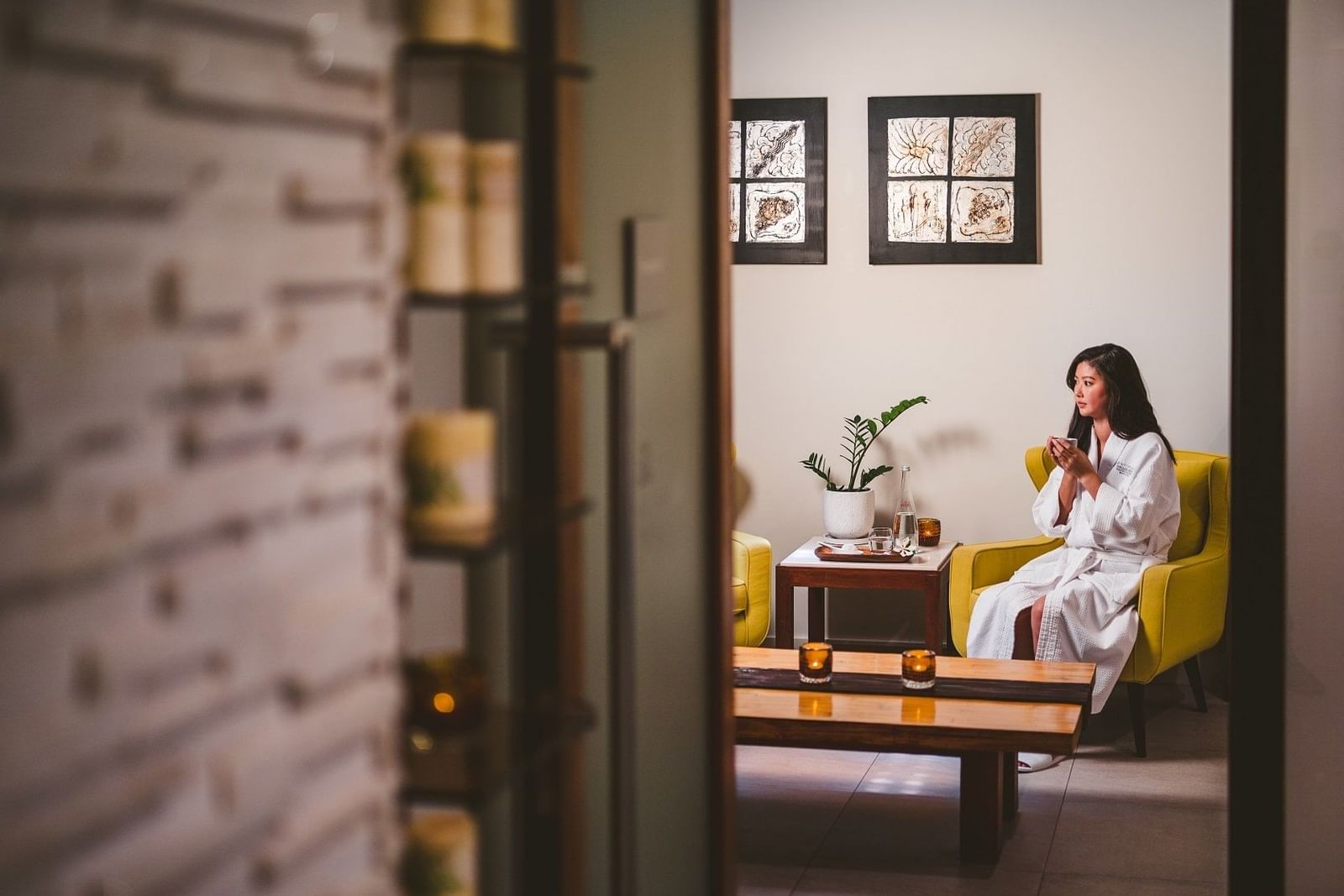 Lady drinking tea in the spa at Pullman Palm Cove Sea Temple Res