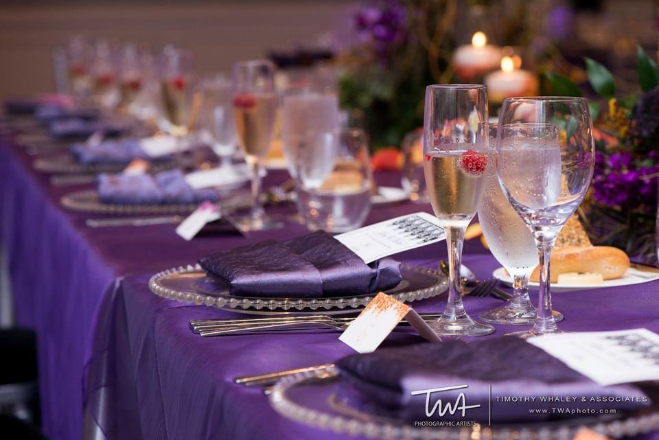 plates and silverware on a large table