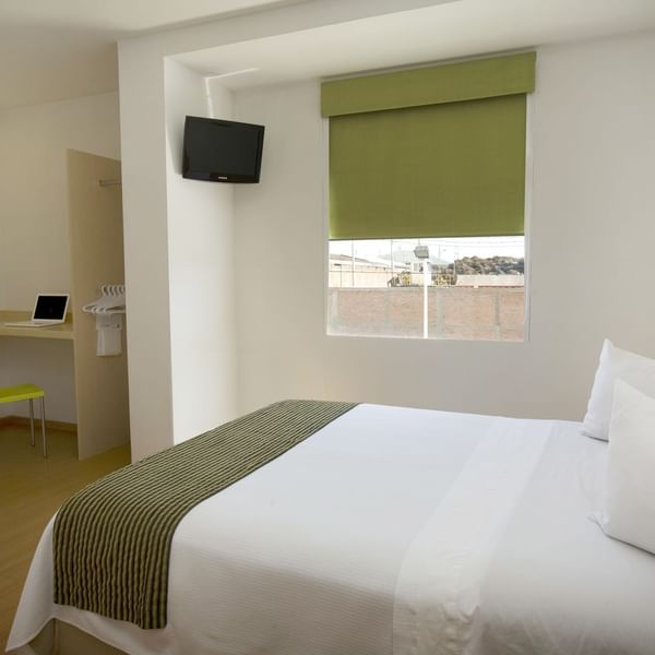 Bed & working desk in Accessible Room at One Hotels