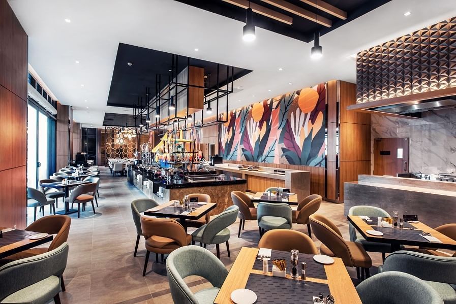 Modern interior of Pendas Cafe dining area with bar counter at Sunway Hotel Big Box