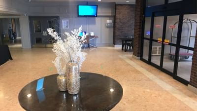 flowers pot on shiny table near entrance at The Inn of Waterloo
