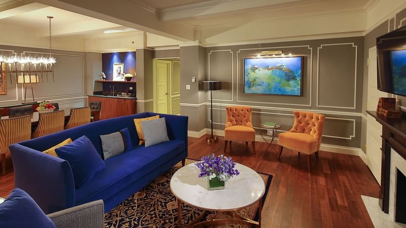 Living area with couches and dining table in Randolph Suite at Warwick New York