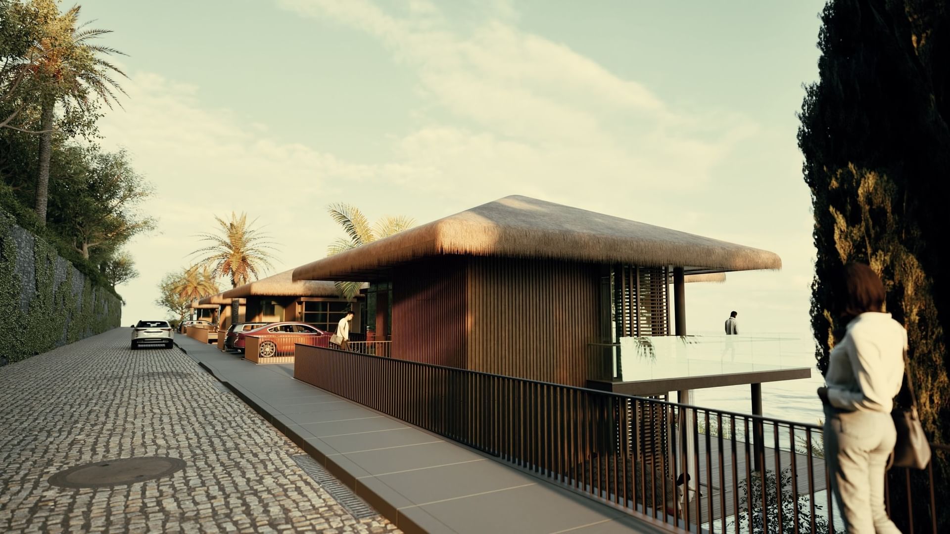 Thatched-roof BlueZone Villas with a modern exterior, a wooden deck, and a view of the ocean at A'ila Villas