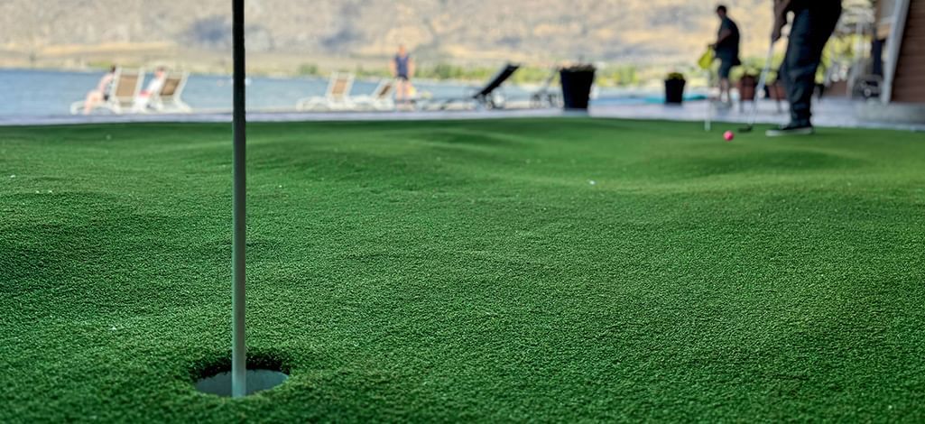 Beachfront hotel amenities including a putting green