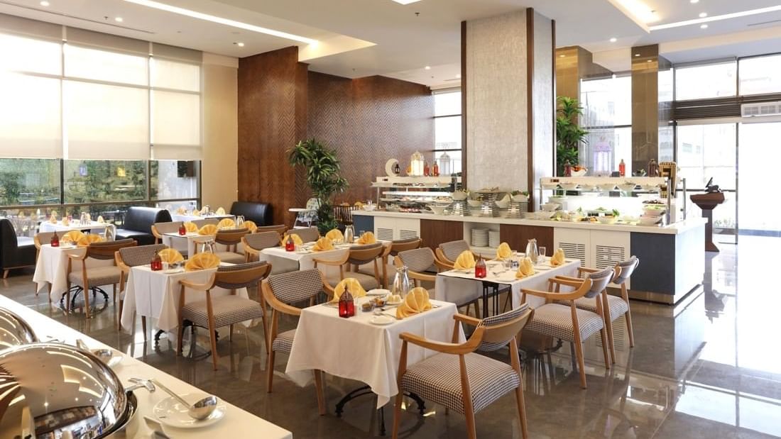 Dining table arrangements in Seasons Restaurant at Warwick Hotel Jeddah