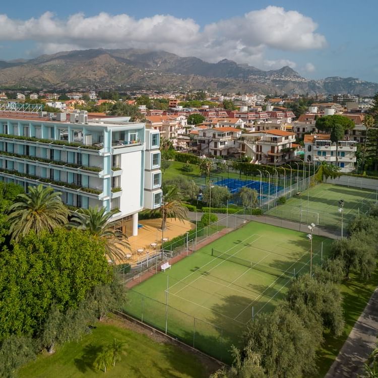 UNAHOTELS Naxos Beach Sicilia - Hotel and Tennis Court View