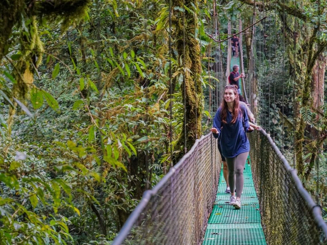 A Girl on Heliconia Hanging Bridges near Rio Celeste Hideaway